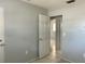 Empty bedroom with gray walls and tile floor, featuring a door leading to another room at 1386 19Th St, Sarasota, FL 34234