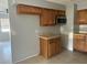 Kitchen featuring wood cabinets and stainless steel microwave at 1386 19Th St, Sarasota, FL 34234