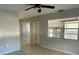 Living room with tile floors, ceiling fan, and doorway at 1386 19Th St, Sarasota, FL 34234