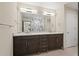 Modern bathroom with double vanity, large mirror, and contemporary light fixtures at 199 Dali Blvd # 302, St Petersburg, FL 33701