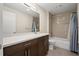 Guest bathroom with tiled shower/tub, modern vanity, and neutral color scheme at 199 Dali Blvd # 302, St Petersburg, FL 33701