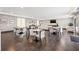 Clubhouse sitting area with tables, chairs, and natural light at 199 Dali Blvd # 302, St Petersburg, FL 33701