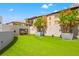 Spacious dog park with turf, planters, and a seating area at 199 Dali Blvd # 302, St Petersburg, FL 33701