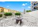 Cozy fire pit area with seating and an umbrella at 199 Dali Blvd # 302, St Petersburg, FL 33701