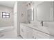 Bathroom with double vanities, modern fixtures, and a tub/shower combo at 214 N Montclair Ave, Brandon, FL 33510