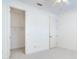 Empty bedroom with a ceiling fan, walk-in closet, and carpeted flooring at 2606 Espana Ct, Tampa, FL 33609