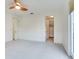 Large bedroom with walk-in closet and access to balcony at 2606 Espana Ct, Tampa, FL 33609