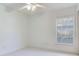 Bright bedroom with ceiling fan, carpeted flooring, and window with blinds at 2606 Espana Ct, Tampa, FL 33609