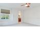 Spacious bedroom with a ceiling fan, window, and ensuite bathroom at 2606 Espana Ct, Tampa, FL 33609