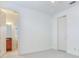 Bright, empty bedroom with attached bathroom, ceiling fan at 2606 Espana Ct, Tampa, FL 33609
