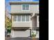 A close-up view of the front of a townhouse with two garages at 2606 Espana Ct, Tampa, FL 33609