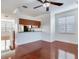 Bright kitchen with wood cabinets, granite countertops, stainless steel appliances, and breakfast bar at 2606 Espana Ct, Tampa, FL 33609