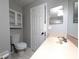 Bathroom with single vanity, toilet, and tile flooring at 27355 Breakers Dr, Wesley Chapel, FL 33544