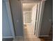 Clean bathroom with shower, toilet, and tiled floor at 27355 Breakers Dr, Wesley Chapel, FL 33544