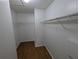 Walk-in closet with ample storage space and wire shelving at 27355 Breakers Dr, Wesley Chapel, FL 33544