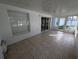 Spacious sunroom with tiled floor and large windows at 27355 Breakers Dr, Wesley Chapel, FL 33544