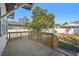 Backyard deck with wooden railings, steps, and a view of the yard at 307 W Frierson Ave, Tampa, FL 33603