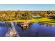 Community lake with gazebo and fountain, surrounded by trees at 3500 Woodridge Pl, Palm Harbor, FL 34684