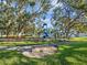 Community playground near the waterfront with slides and climbing structures at 3500 Woodridge Pl, Palm Harbor, FL 34684