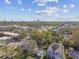 Beautiful aerial view of the house nestled in the neighborhood with the city skyline in the distance at 3602 W Dale Ave, Tampa, FL 33609