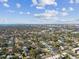 Stunning aerial view overlooking the neighborhood and the cityscape beyond at 3602 W Dale Ave, Tampa, FL 33609