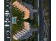 An aerial view of the property, pool, and marina at 370 Pinellas Bayway S # E, Tierra Verde, FL 33715