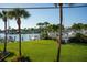 Tropical backyard oasis with palm trees and marina views at 370 Pinellas Bayway S # E, Tierra Verde, FL 33715
