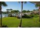 Private backyard with lush landscaping and marina access at 370 Pinellas Bayway S # E, Tierra Verde, FL 33715