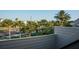 Balcony view overlooking palm trees and street at 370 Pinellas Bayway S # E, Tierra Verde, FL 33715