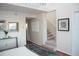 Bedroom with carpeted stairs, neutral decor, and artwork at 370 Pinellas Bayway S # E, Tierra Verde, FL 33715