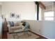 Cozy living room area with a small sofa, coffee table, and floor lamp at 370 Pinellas Bayway S # E, Tierra Verde, FL 33715