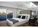Large main bedroom with tufted headboard, sliding glass door and high ceilings at 370 Pinellas Bayway S # E, Tierra Verde, FL 33715