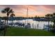 Tranquil marina view at sunset with docked boats and lush green lawn at 370 Pinellas Bayway S # E, Tierra Verde, FL 33715