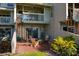 Private patio with spiral staircase, fire pit, and lush greenery at 370 Pinellas Bayway S # E, Tierra Verde, FL 33715