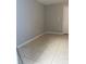 Empty room with gray walls and tile flooring at 4549 Ontario Dr, New Port Richey, FL 34652