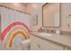 Bathroom featuring a rainbow shower curtain, a single vanity, and neutral-toned walls at 4603 Overlook Ne Dr, St Petersburg, FL 33703