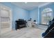 Blue bedroom with bunk beds, a desk, and large window at 4603 Overlook Ne Dr, St Petersburg, FL 33703