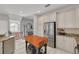Kitchen with white cabinetry, stainless steel appliances, granite countertops, and a butcher block island at 4603 Overlook Ne Dr, St Petersburg, FL 33703