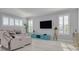 Living room with large TV and comfortable seating at 4603 Overlook Ne Dr, St Petersburg, FL 33703