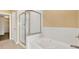 Bathroom with soaking tub and separate shower stall at 4720 Pond Ridge Dr, Riverview, FL 33578