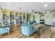 Community lounge with seating and bookshelves at 4775 Cove Cir # 904, St Petersburg, FL 33708