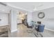 Dining area with glass table and chairs, kitchen view at 4775 Cove Cir # 904, St Petersburg, FL 33708