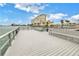 Community dock with benches overlooking the water at 4775 Cove Cir # 904, St Petersburg, FL 33708