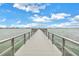 Long wooden walkway extending into the water at 4775 Cove Cir # 904, St Petersburg, FL 33708