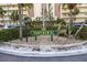 Building entrance with landscaping and signage at 4775 Cove Cir # 904, St Petersburg, FL 33708