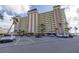 Building exterior featuring parking and landscaping at 4775 Cove Cir # 904, St Petersburg, FL 33708