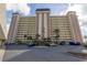 High-rise building with parking and landscaping at 4775 Cove Cir # 904, St Petersburg, FL 33708