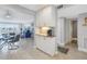 White kitchen cabinets, granite countertops, coffee bar area at 4775 Cove Cir # 904, St Petersburg, FL 33708