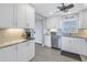 Updated kitchen with granite countertops and white cabinets at 4775 Cove Cir # 904, St Petersburg, FL 33708