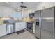 Modern kitchen with stainless steel appliances and granite counters at 4775 Cove Cir # 904, St Petersburg, FL 33708